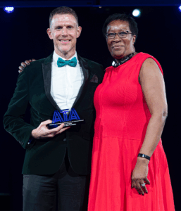 Sharon Blyfield presenting an award in 2025