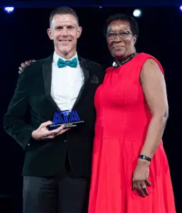 Sharon Blyfield presenting an award in 2025